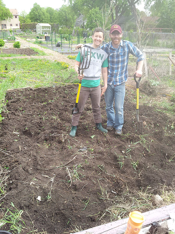Digging up a neglected community garden plot in Minneapolis